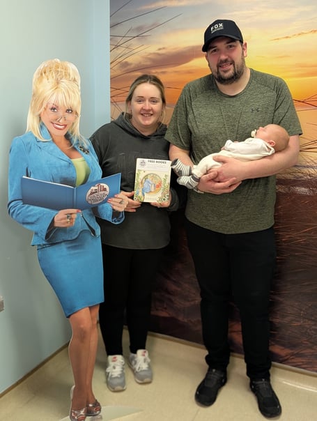 The Harris family pictured with the Dolly Parton cut up