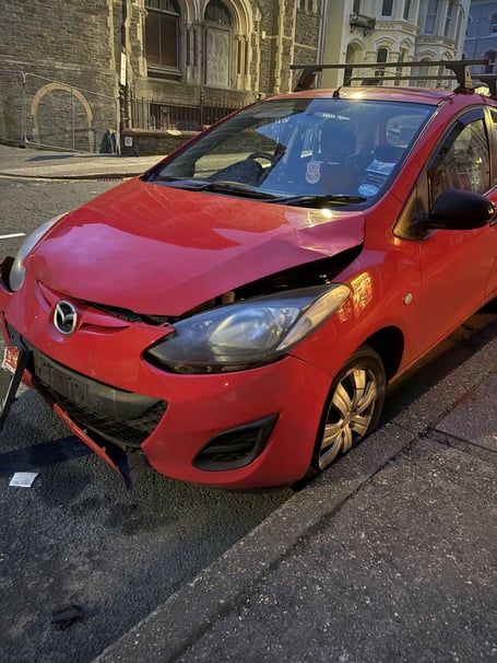 Mazda damaged in hit and run collision