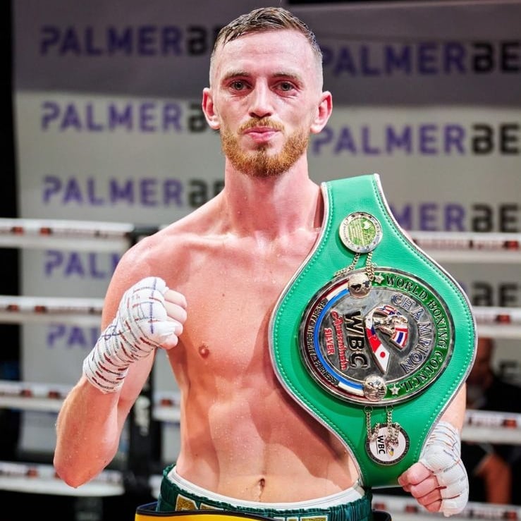 Sam Rennie with the two belts he is current holder of