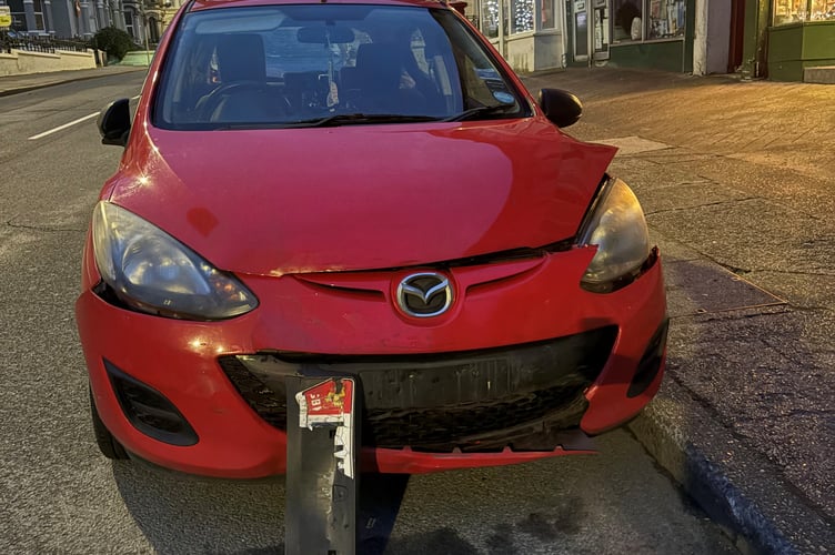 Hit and run collision caused major front end damage to this Mazda
