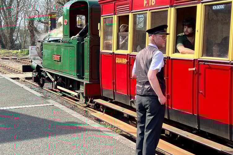 Stationmaster Grant Taylor sees off a busy Port Erin-bound train on the first day of the 2026 season