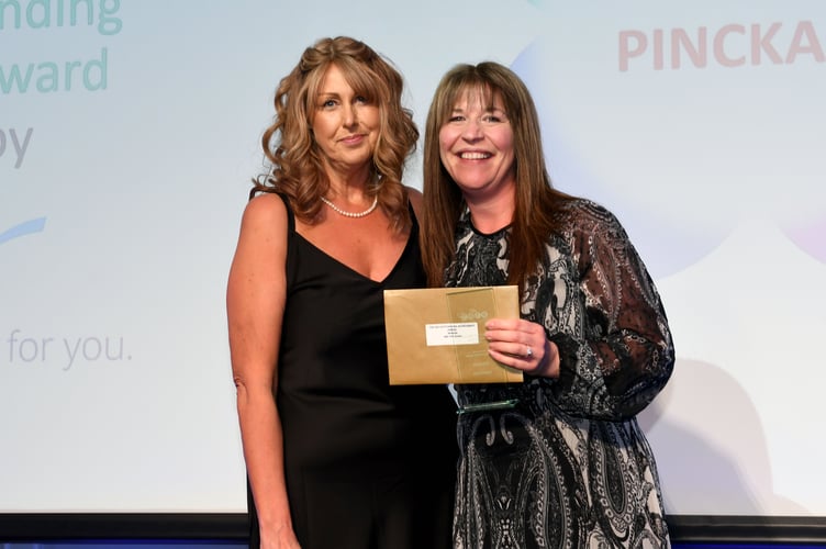 Mel Pinckard, winner of the CEO Outstanding Achievement Award. Presented by Teresa Cope, CEO of Manx Care