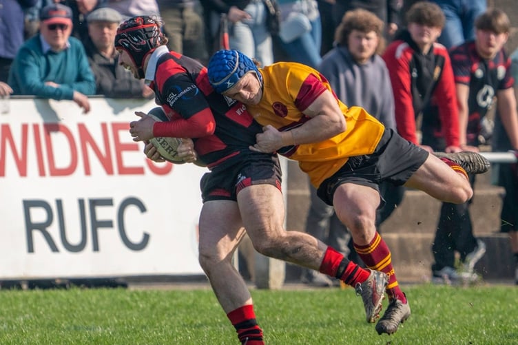 Zak Wickman attempts to haul down a Widnes opponent during Saturday's league match at Heath Road (Photo: Ian Moss)