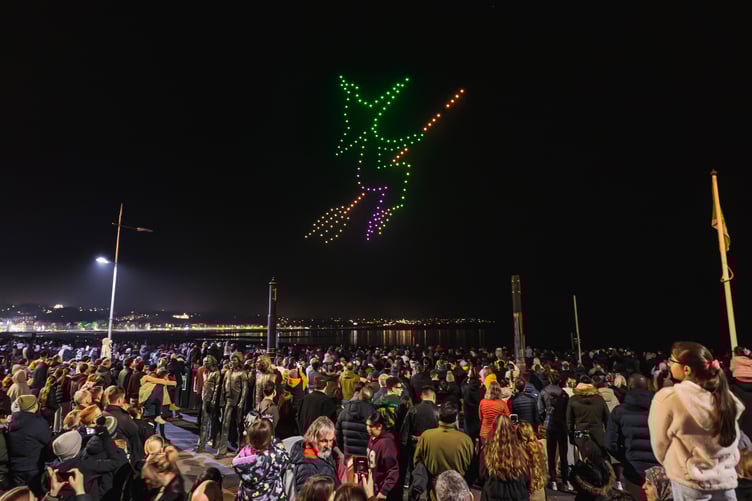 Ginny the Witch flies over Douglas harbour at the free drone show