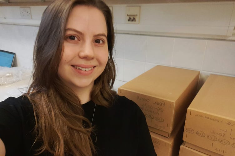 Isobel with boxes of skeletal remains from Isle of Man burial sites