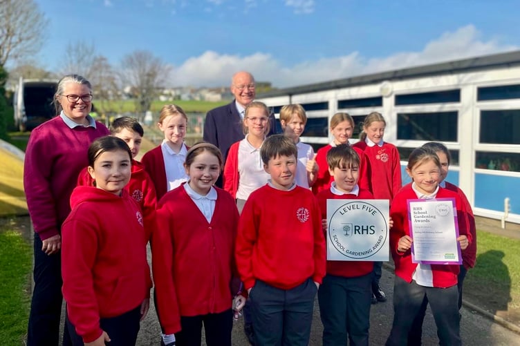Pupils at Ashley Hill Primary School with their Level 5 certificate, accompanied by the Lieutenant Governor Sir John Lorimer