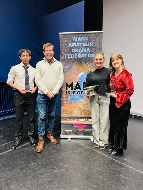 Left to right: Runner up Womo Holden, judge Edward Bennett, and the joint winners Maddie Wood and Emma-Louise Taylor