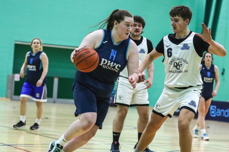 DGU Jets' Logan Glover defends against PwC Hoops' Gemma Kirkham on the ball (Photo: Martin Dunne)