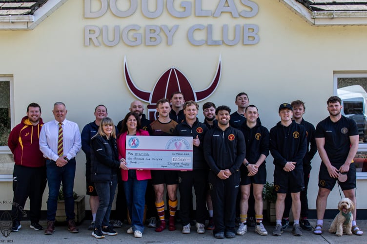 Douglas Rugby Club’s Anne Howarth presents Kimberley Moughtin of the Manx Breast Cancer Support Group with a cheque for £2,500 from the club's annual Mhelliah at Port-e-Chee (Photo: Richard Ebbutt)
