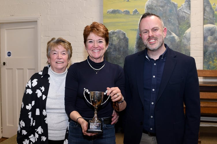 Janet McDowell, winner of the Senior Solo class and winner of the Sue Howe Trophy for Best Ladies Solo, with her mother accompanist Wendy McDowell (left) and musical adjudicator Gareth Moore (right)