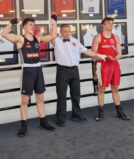 Manx ABC's Finley Sweet (left) has his armed raised by the referee following his victory in Liverpool at the weekend