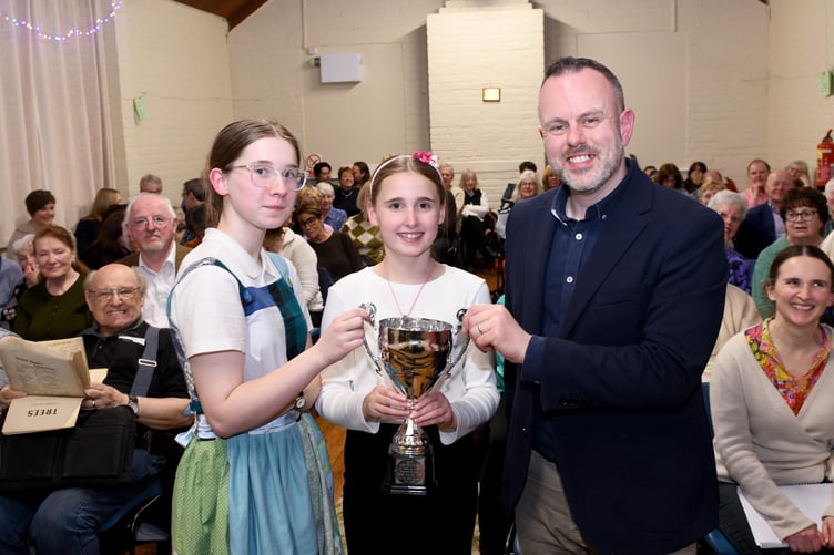 River and Willow Kelly-Brown, winners of the Eric Goldie Trophy for Best Performer 21 years and under, with musical adjudicator Gareth Moore