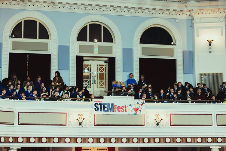 Children watch on from upstairs