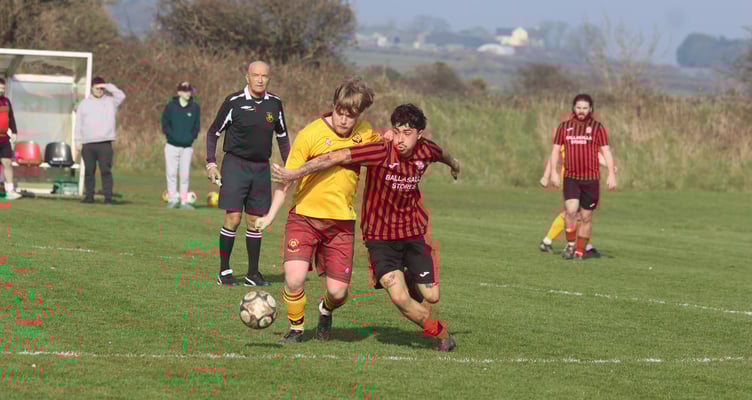Marown's Nick Corlett and Malew's Joaquim Douglas in action during the pair's recent Woods Cup semi-final at Clagh Vane (Photo: Paul Hatton)