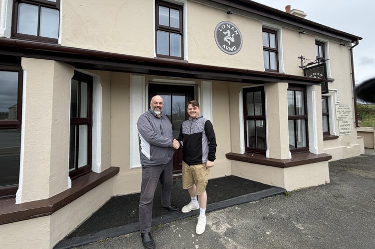 Director of Lonan Arms owner LA2 Alan Clague (left) hands over the keys of the commercial unit to Lee Moffatt who will run a cafe from the site