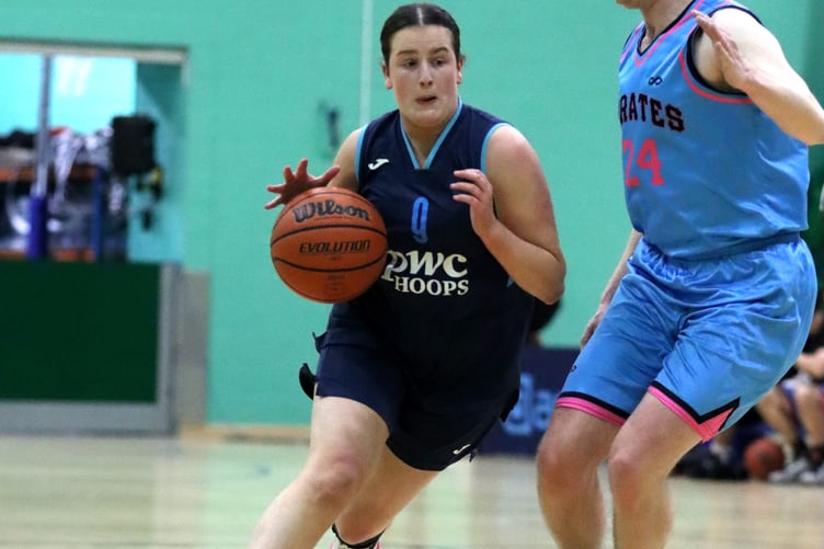 Mairi Harrison drives down the court for Hoops against the defence of Pirates' Nick Hamer (Photo: Martin Dunne)