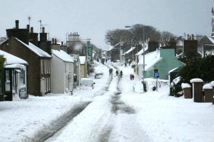 A snowy scene of Kirk Michael in 2013