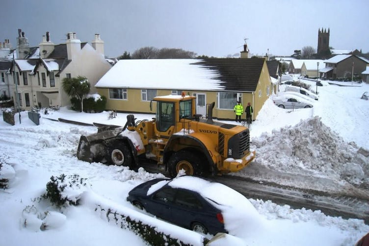A plough tries to clear the roads after the 2013 snowstorm