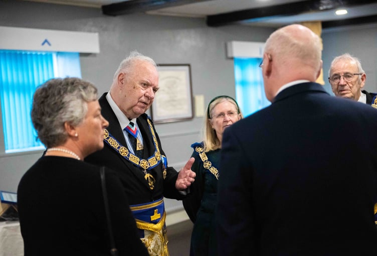 Head of the island’s freemasons Michael Shimmin has a chat with the Lieutenant Governor Sir John Lorimer and Lady Lorimer