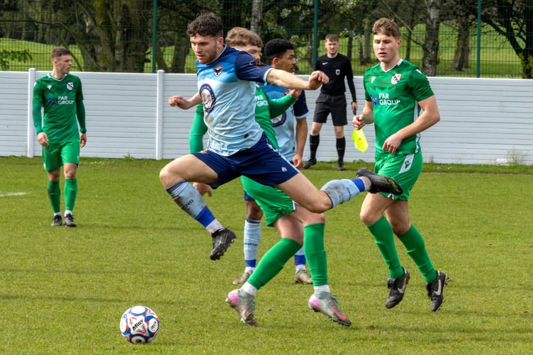 Jacob Crook hurdles a challenge from a Charnock Richard opponent during the weekend's match in Chorley (Photo: Hannah McHugh)