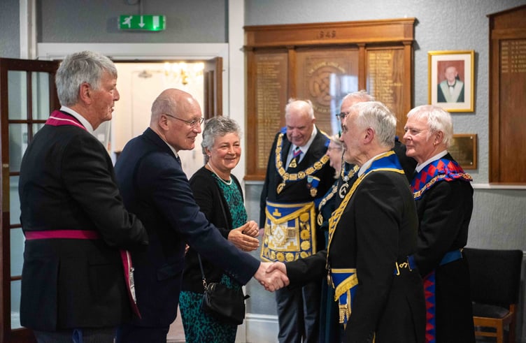 From left: Communications officer Tim Earl introduces Sir John Lorimer and Lady Lorimer to museum curator Derek Peters