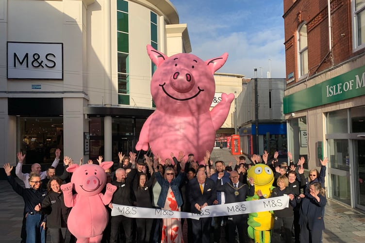 M&S staff join the Lieutenant Governor Sir John Lorimer and Douglas Mayor Steven Crellin for the ribbon-cutting outside the newly refurbished store