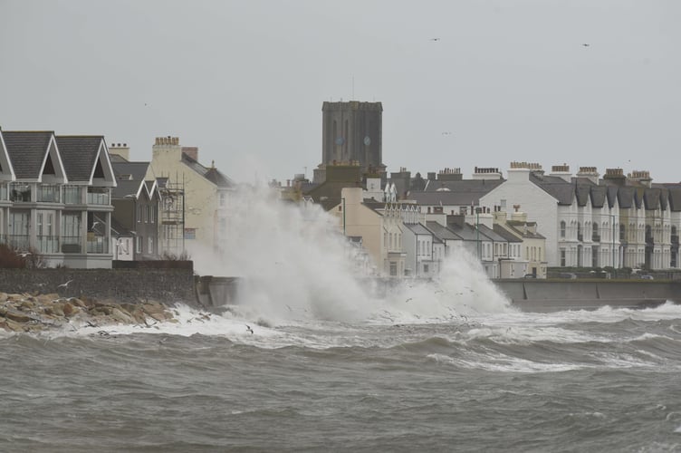 Previous waves breaking over Castletown promenade