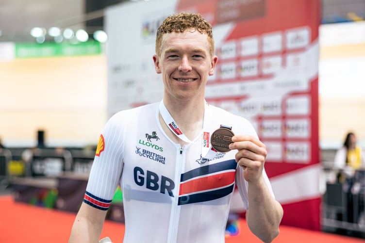 Matthew Bostock with his bronze medal which he won in the men's omnium at the UCI Track World Cup in China over the weekend (Photo: Alex Whitehead/SWpix.com)