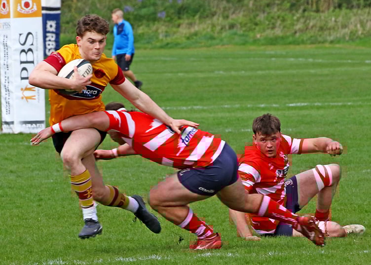 Douglas Rugby Club's Josh Duncan is tackled by a Vale of Lune opponent during Saturday's Regional North West Two playoff (Photo: Tony North)
