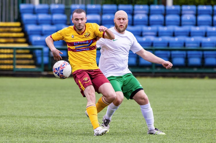 Marown's Alex Marley (left) and St Marys' Chris Walsh compete for the possession during last weekend's Hospital Cup clash at the Bowl (Photo: Gary Weightman)