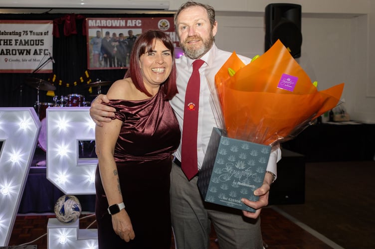 Marown gaffer and the longest serving football manager in Manx football, David Brew, gave a bouquet of flowers to club secretary Helen Withers