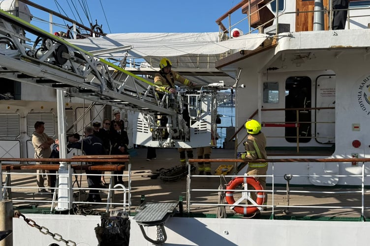 Crews used a turntable ladder to extricate the injured person from the ship