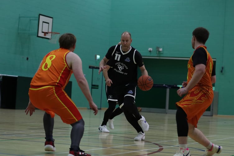 DGU Jets Wayne Mears drives down the court as the Southern Phoenix defence shifts to block the lane (Photo: Martin Dunne)