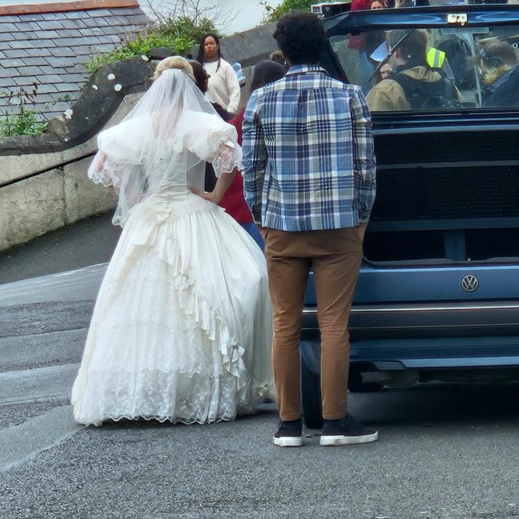 The runaway bride waits for her next scene