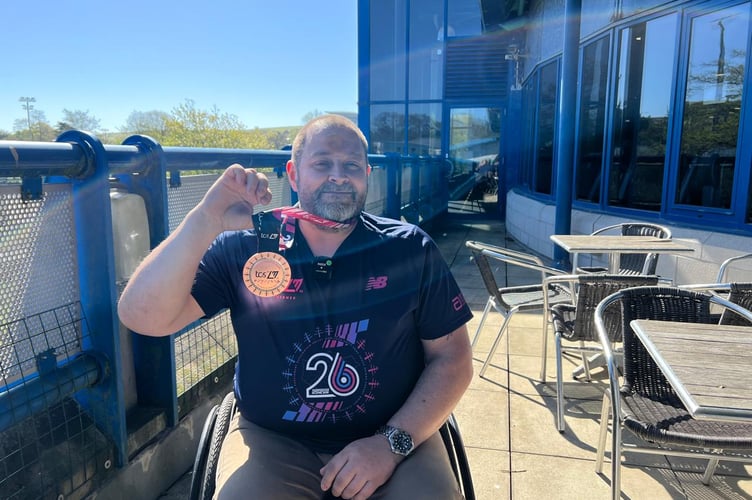 Mike Ryan with his London Marathon medal outside the National Sports Centre (NSC)
