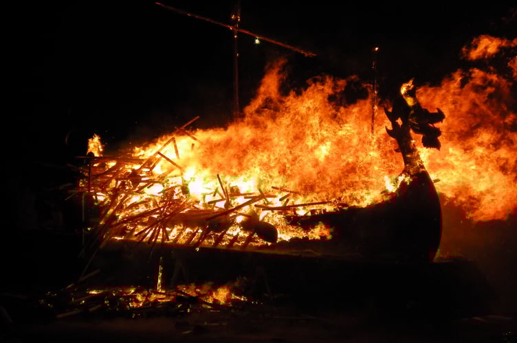 The Up Helly AA fire festival culminates in the burning of a replica Viking galley