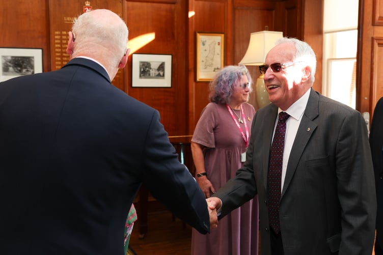 The Lieutenant Governor Sir John Lorimer welcomes Mrs Whiteway's dad, and the first Chief Minister of the Isle of Man, Sir Miles Walker