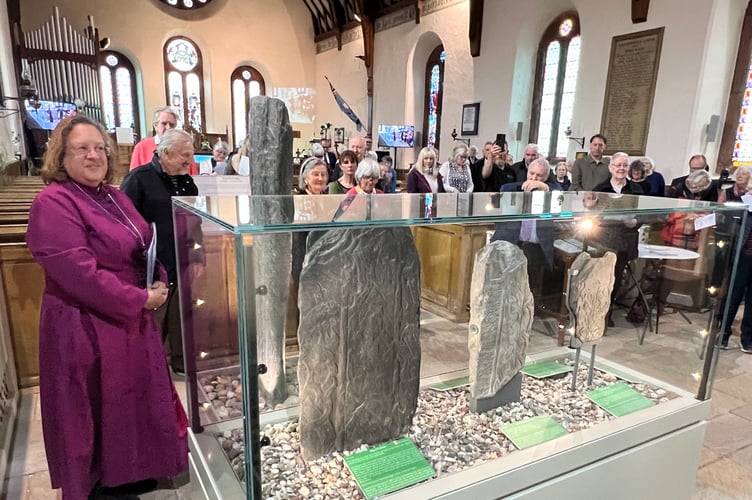 The Lord Bishop blesses the display showcase at Kirk Andreas