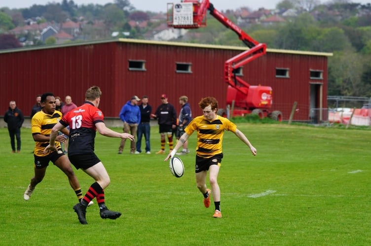 Vagabonds Nathan Wyllie attempts to chip over the Ramsey defence during Saturday's game at Port-e-Chee (John Liver/Mumbles Pics)