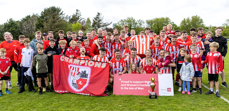 Peel AFC players and their family and friends celebrate after the westerners won the Canada Life Premier League title. A No.4 shirt can be seen in tribute to club's late combination captain Kian Broadhead, who sadly died earlier this season (Photo: Gary Weightman)