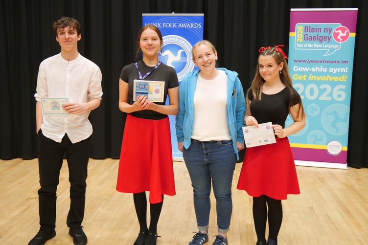 Secondary age Manx dancers Frank Joughin, Onnee Ayres and Emily Faragher with adjudicator, Rachel Corlett.