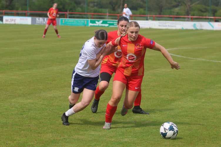 Isle of Man's Holly Sumner battles with a Preston North End opponent during last weekend's friendly in Longridge (Photo: Paul Hatton)