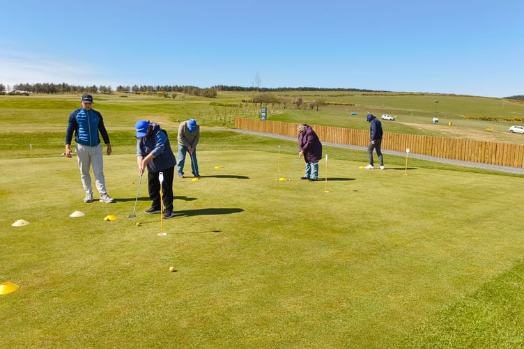 Sight Matters service users using the practice putting green at Mount Murray