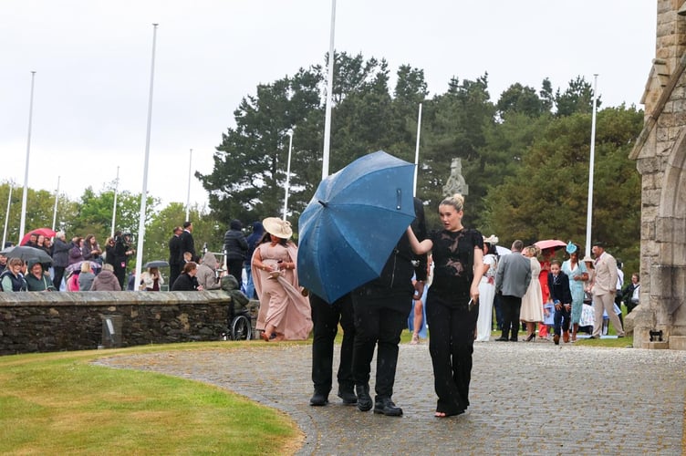 Love Island star Molly-Mae Hague braves the rain after the ceremony (Credit: CJS Photography)