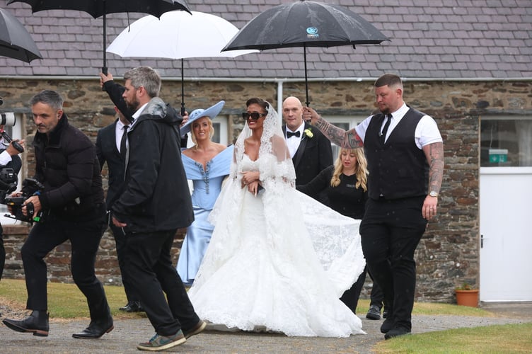 Venezuela Fury walking into St John's church with dad Tyson and mum Paris (Credit: CJS Photography)