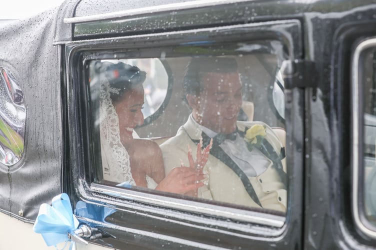 Venezuela Fury and Noah Price leaving their wedding in a vintage motorcar