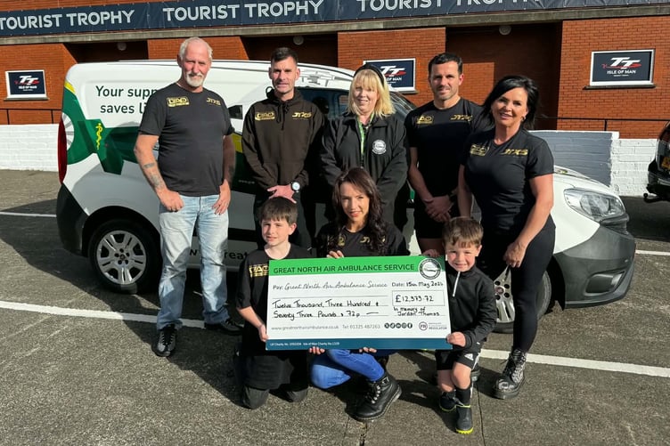 Family and friends of Jordan Thomas present cheque to the Great North Air Ambulance after a gruelling charity challenge in his memory