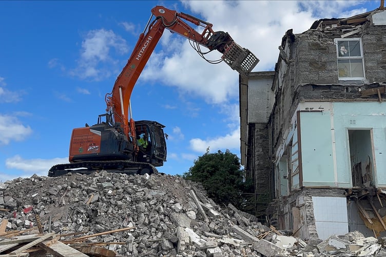 Work continues to reduce the old hotel to rubble