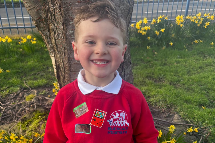 Student from Bunscoill Rhumsaa with Manx stickers on his jumper