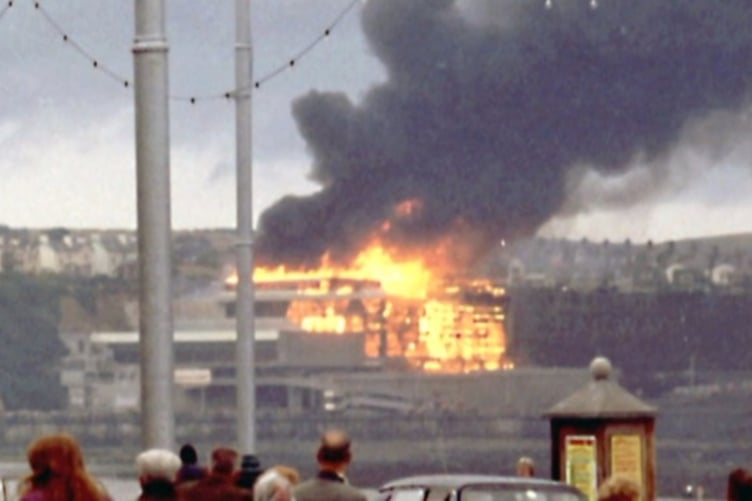 The scene of horror as onlookers watch the blaze take hold at Summerland